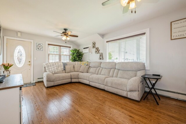 203 E Shore Rd, Lindenhurst, NY 11757 - living room featuring a ceiling fan, wood finished floors, and a baseboard radiator