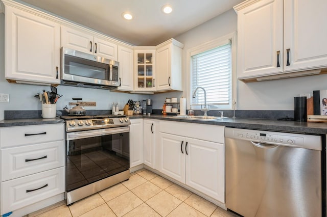 203 E Shore Rd, Lindenhurst, NY 11757 - kitchen featuring appliances with stainless steel finishes, a sink, dark countertops, and recessed lighting