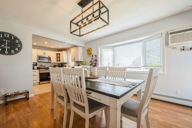 203 E Shore Rd, Lindenhurst, NY 11757 - dining room featuring a wall unit AC, light wood-style floors, a chandelier, baseboards, and recessed lighting