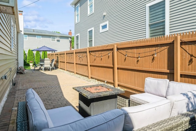 203 E Shore Rd, Lindenhurst, NY 11757 - fenced backyard featuring an outdoor living space, a patio, and outdoor dining space