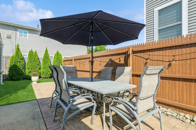 203 E Shore Rd, Lindenhurst, NY 11757 - fenced backyard with outdoor dining space and a patio area
