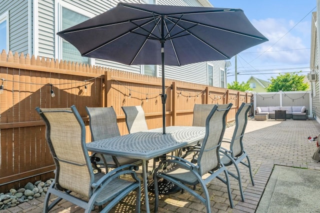 203 E Shore Rd, Lindenhurst, NY 11757 - fenced backyard featuring outdoor lounge area, outdoor dining space, and a patio area