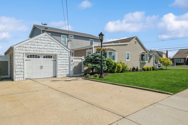 203 E Shore Rd, Lindenhurst, NY 11757 - view of front facade featuring a front yard, driveway, and a garage