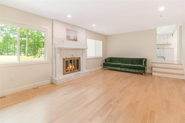 34 Winesap Ln, Monsey, NY 10952 - living area with wood finished floors, baseboards, a brick fireplace, and recessed lighting