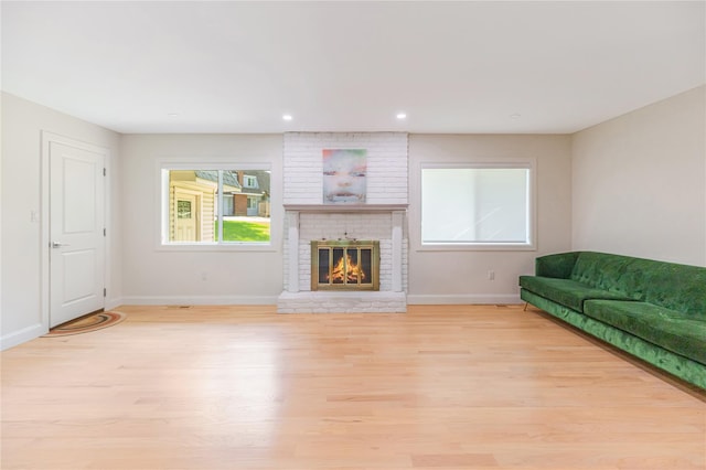 34 Winesap Ln, Monsey, NY 10952 - living room featuring light wood-style floors, baseboards, a fireplace, and recessed lighting