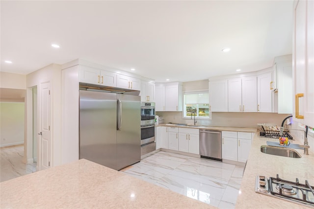 34 Winesap Ln, Monsey, NY 10952 - kitchen featuring stainless steel appliances, a sink, light marble finish flooring, recessed lighting, and white cabinetry