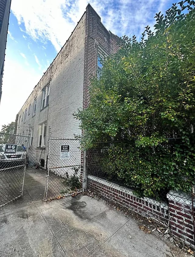 348 Legion St, Brooklyn, NY 11212 - view of property exterior with a gate