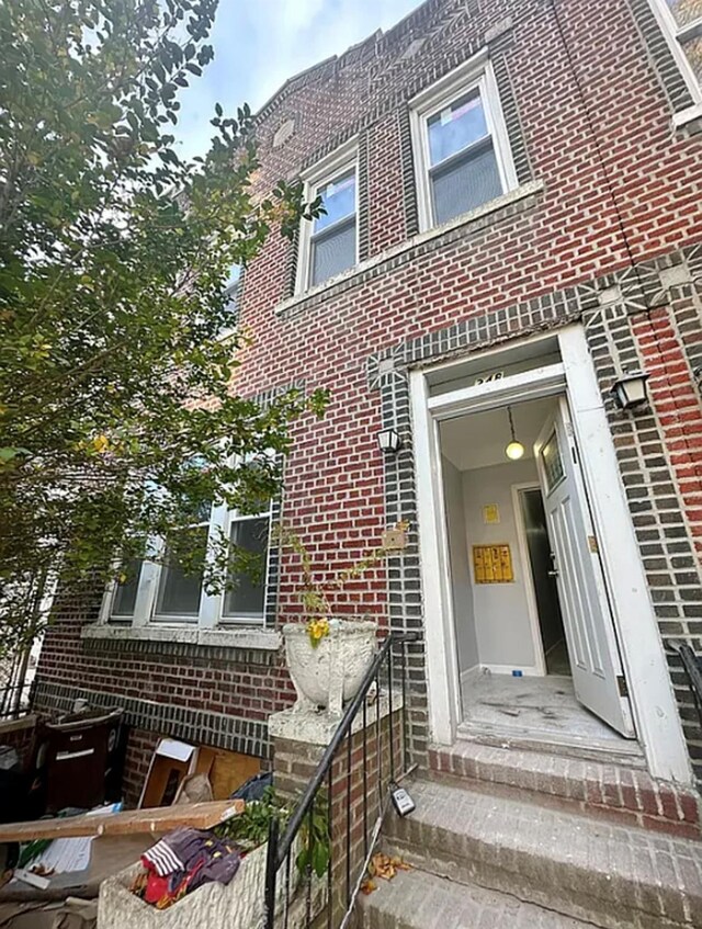 348 Legion St, Brooklyn, NY 11212 - doorway to property featuring brick siding