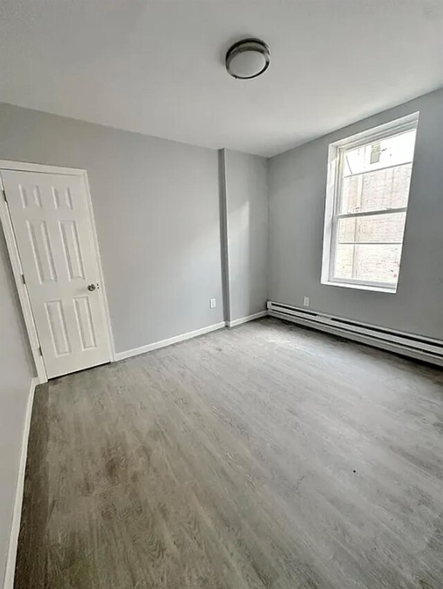 348 Legion St, Brooklyn, NY 11212 - empty room featuring wood finished floors and baseboards