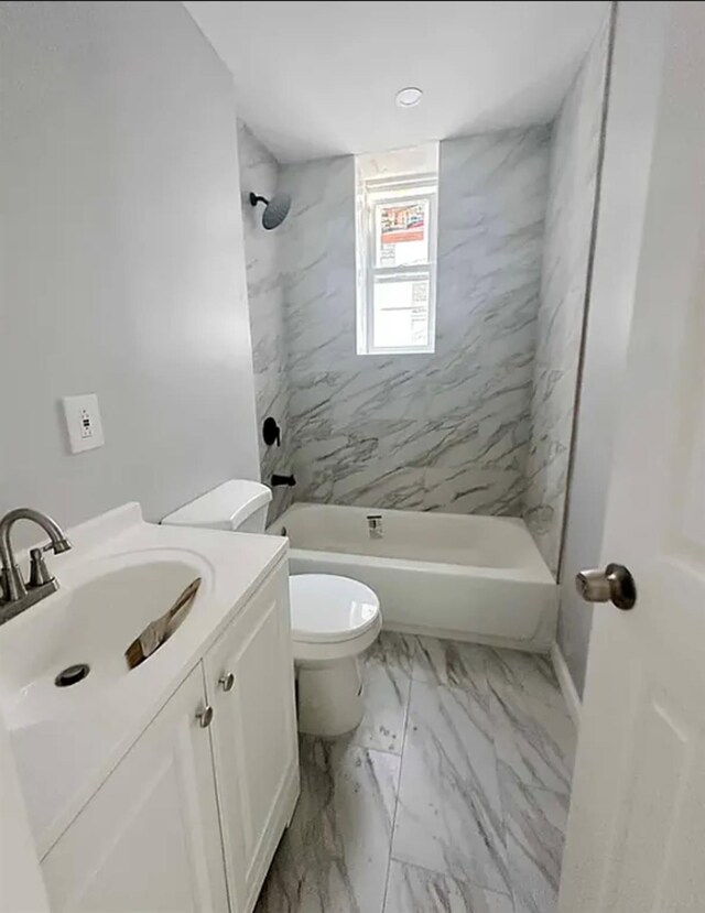 348 Legion St, Brooklyn, NY 11212 - bathroom featuring vanity, toilet,  shower combination, and marble look tile flooring