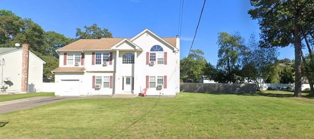 141 N 28th St, Wheatley Heights, NY 11798 - view of front facade featuring a garage and driveway