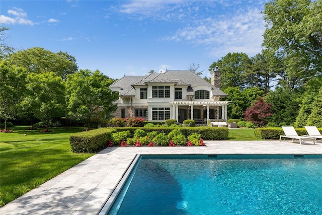 22 Terrace Ct, Old Westbury, NY 11568 - rear view of property with a pergola, a lawn, and an outdoor pool