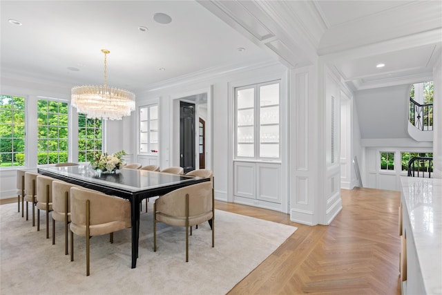 22 Terrace Ct, Old Westbury, NY 11568 - dining space with a chandelier, crown molding, healthy amount of natural light, and a decorative wall