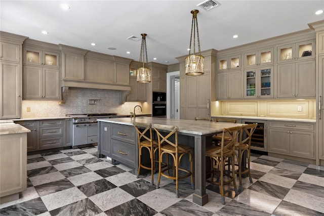 22 Terrace Ct, Old Westbury, NY 11568 - kitchen with oven, beverage cooler, gray cabinets, an island with sink, and decorative backsplash