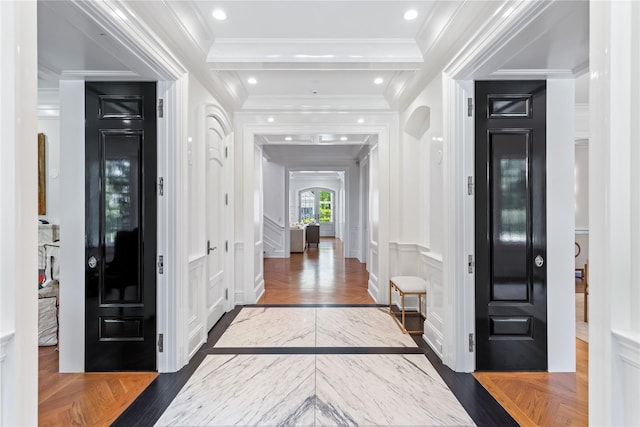 22 Terrace Ct, Old Westbury, NY 11568 - entryway featuring a decorative wall, wood finished floors, ornamental molding, and arched walkways