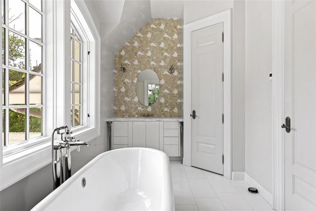 22 Terrace Ct, Old Westbury, NY 11568 - bathroom with tile patterned flooring, a freestanding bath, and vaulted ceiling