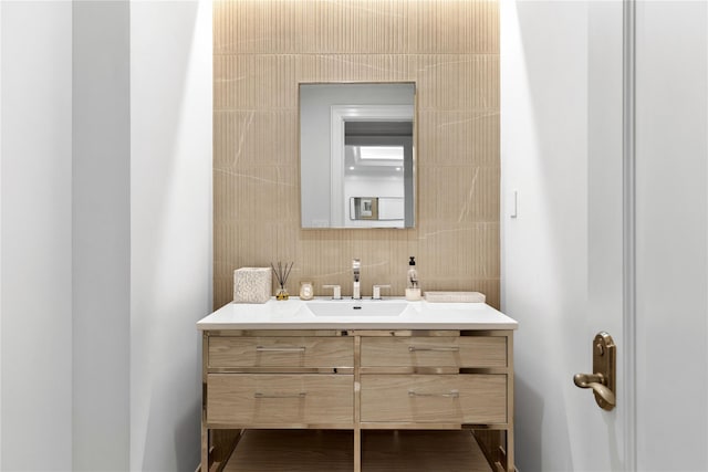22 Terrace Ct, Old Westbury, NY 11568 - bathroom with vanity, tasteful backsplash, and tile walls