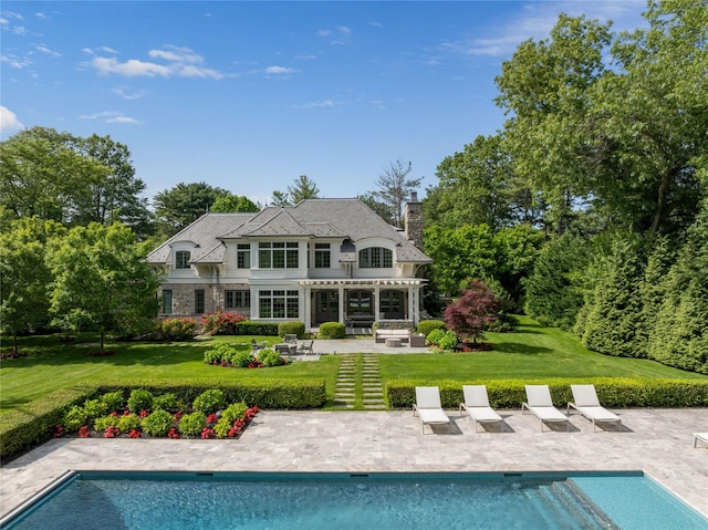 22 Terrace Ct, Old Westbury, NY 11568 - rear view of house featuring a pergola, a patio area, an outdoor pool, a lawn, and a chimney