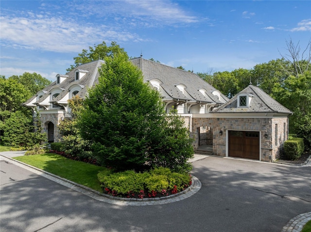 22 Terrace Ct, Old Westbury, NY 11568 - view of front of house with a high end roof, stone siding, a garage, and asphalt driveway