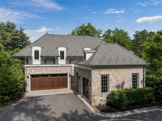22 Terrace Ct, Old Westbury, NY 11568 - french country home with a high end roof, stone siding, and driveway