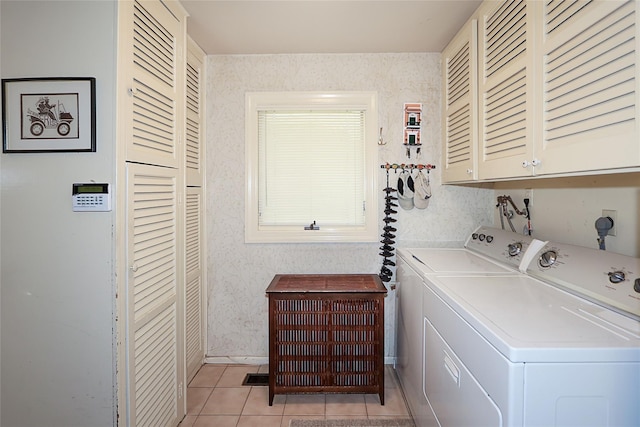 12 Rustic Gate Ln, Dix Hills, NY 11746 - washroom featuring washing machine and dryer, wallpapered walls, cabinet space, and light tile patterned flooring
