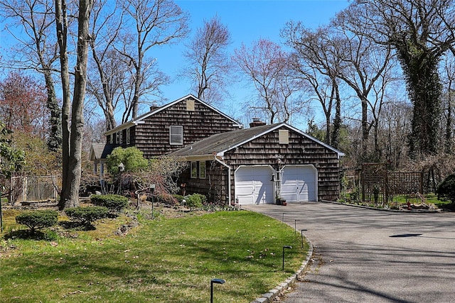 12 Rustic Gate Ln, Dix Hills, NY 11746 - view of front of house with a garage, a chimney, and driveway
