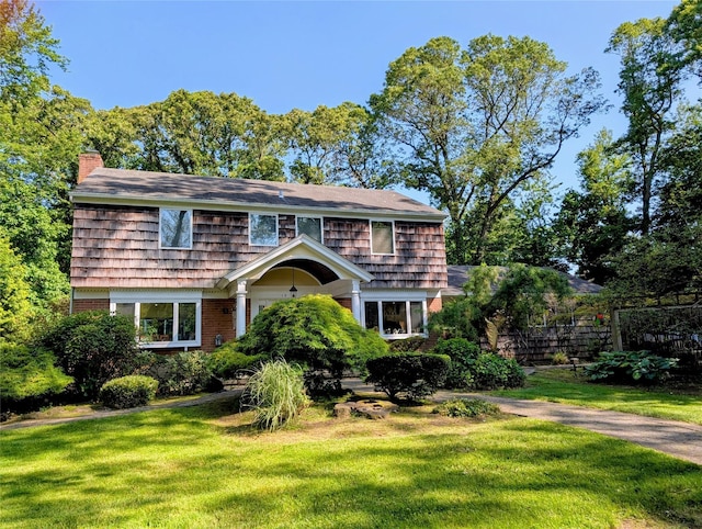 12 Rustic Gate Ln, Dix Hills, NY 11746 - view of front facade with a chimney and brick siding