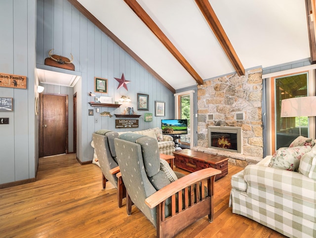 141 Mountain Laurel Ln, Glen Spey, NY 12737 - living room featuring attic access, wood finished floors, a stone fireplace, beamed ceiling, and high vaulted ceiling