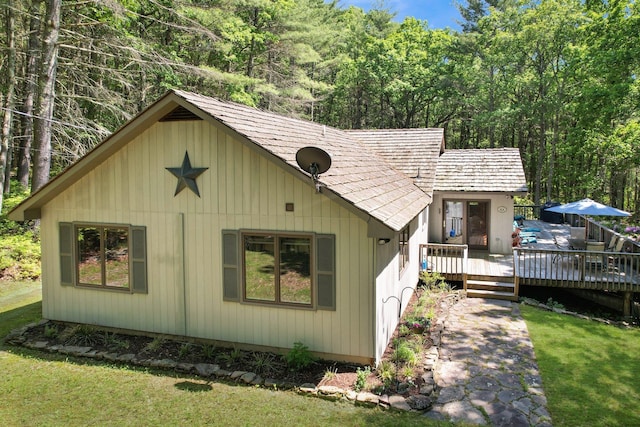 141 Mountain Laurel Ln, Glen Spey, NY 12737 - chalet / cabin with a wooden deck, a front yard, and a wooded view