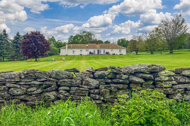 532 Wilbur Hill Rd, Unadilla, NY 13849 - back of house featuring a lawn