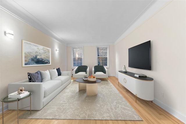 11007 73rd Rd Unit 4D, Forest Hills, NY 11375 - living room featuring wood finished floors, baseboards, and crown molding