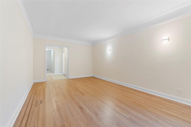 11007 73rd Rd Unit 4D, Forest Hills, NY 11375 - unfurnished room featuring light wood-style flooring, baseboards, and crown molding