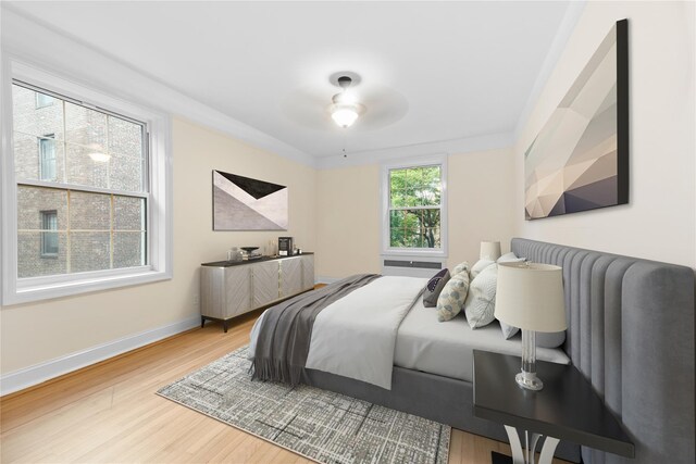 11007 73rd Rd Unit 4D, Forest Hills, NY 11375 - bedroom with wood finished floors, baseboards, and a ceiling fan