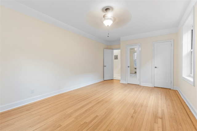 11007 73rd Rd Unit 4D, Forest Hills, NY 11375 - unfurnished bedroom with light wood-type flooring, baseboards, and a ceiling fan