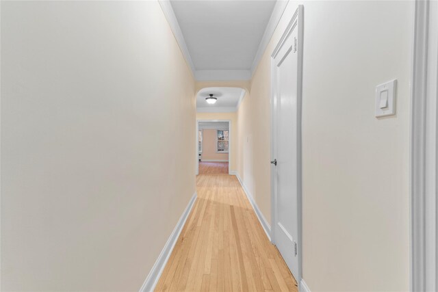 11007 73rd Rd Unit 4D, Forest Hills, NY 11375 - hallway featuring ornamental molding, light wood finished floors, baseboards, and arched walkways