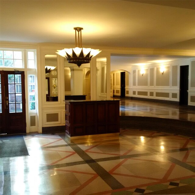 11007 73rd Rd Unit 4D, Forest Hills, NY 11375 - reception area featuring a decorative wall, arched walkways, a chandelier, and french doors