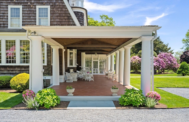 107 Quogue St, Quogue, NY 11959 - covered porch with a yard