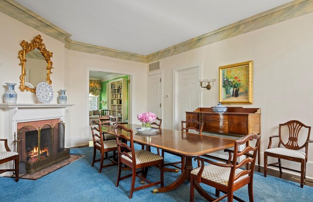 107 Quogue St, Quogue, NY 11959 - carpeted dining room with a fireplace with flush hearth and crown molding