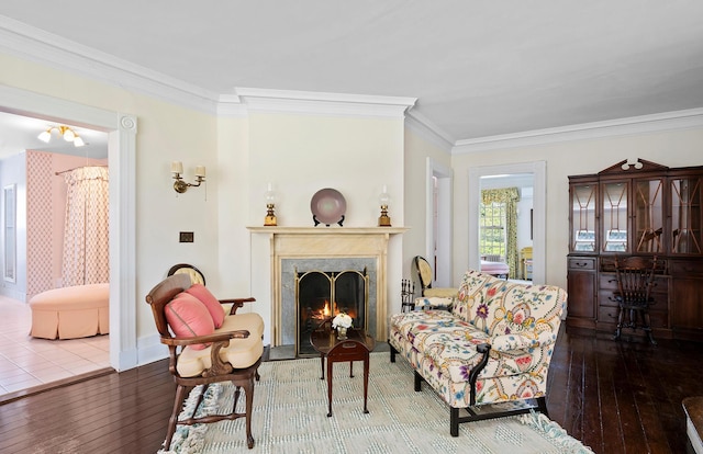 107 Quogue St, Quogue, NY 11959 - living area featuring hardwood / wood-style floors, crown molding, and a fireplace