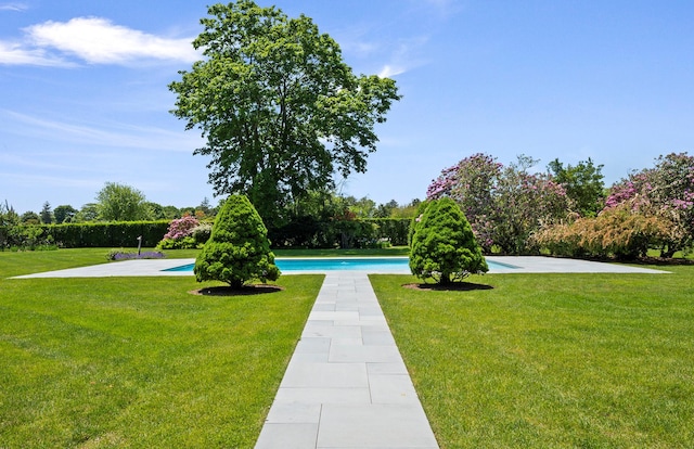 107 Quogue St, Quogue, NY 11959 - view of grassy yard with an outdoor pool