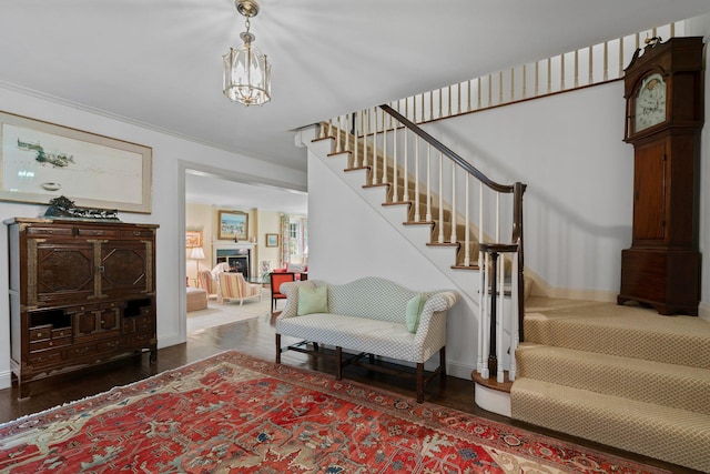 24 Wellington Rd, Locust Valley, NY 11560 - entryway featuring stairs, baseboards, wood finished floors, and ornamental molding