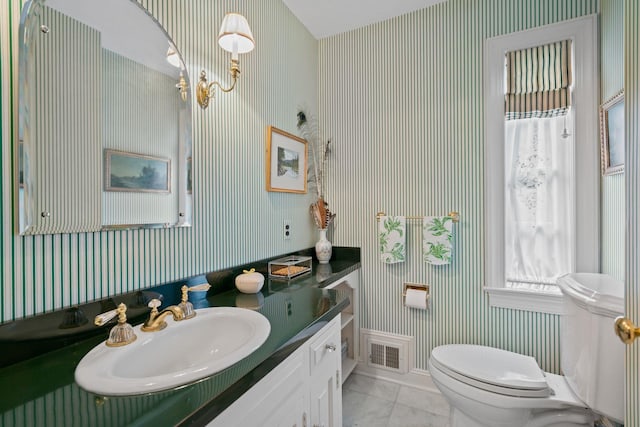 24 Wellington Rd, Locust Valley, NY 11560 - half bath with wallpapered walls, toilet, vanity, baseboards, and tile patterned floors