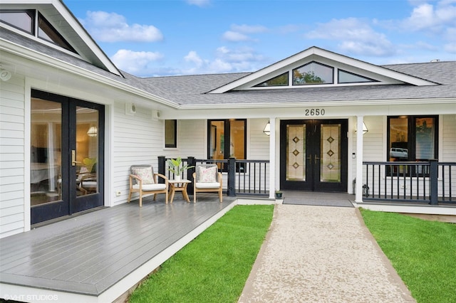 2650 Wickham Ave, Mattituck, NY 11952 - doorway to property featuring french doors, a shingled roof, and covered porch