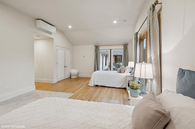 2650 Wickham Ave, Mattituck, NY 11952 - bedroom featuring a wall mounted air conditioner, vaulted ceiling, baseboards, recessed lighting, and wood finished floors