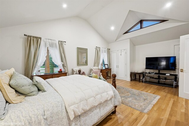 2650 Wickham Ave, Mattituck, NY 11952 - bedroom with high vaulted ceiling, wood finished floors, and recessed lighting