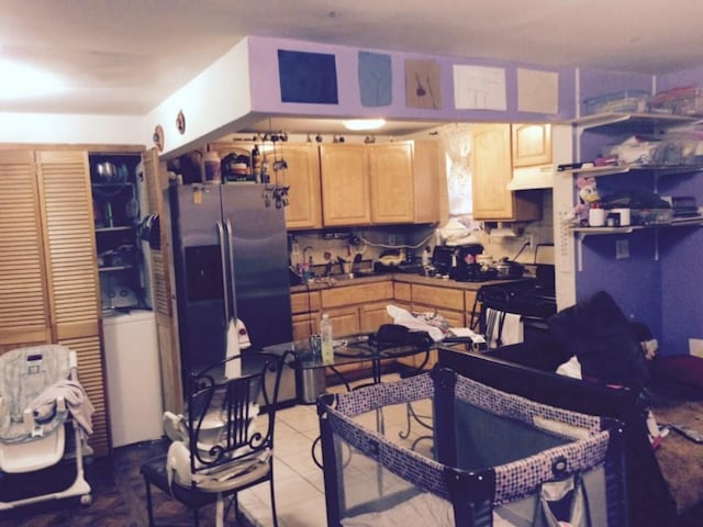 960 E 181st St, Bronx, NY 10460 - kitchen with stainless steel refrigerator with ice dispenser, light brown cabinetry, light tile patterned flooring, under cabinet range hood, and a sink