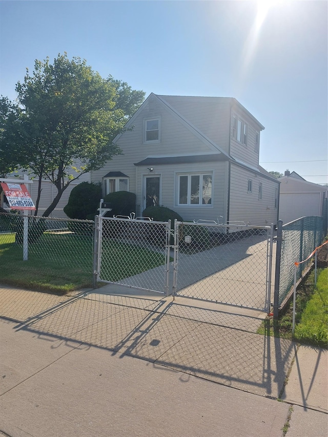 11 John Ave, Hempstead, NY 11003 - traditional-style home featuring a gate