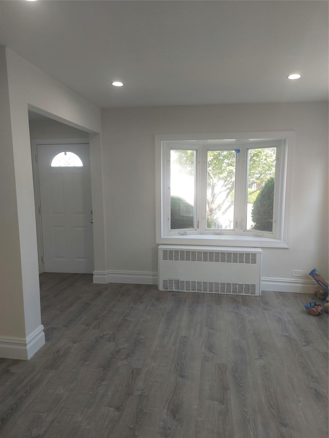 11 John Ave, Hempstead, NY 11003 - entryway with radiator, baseboards, wood finished floors, and recessed lighting