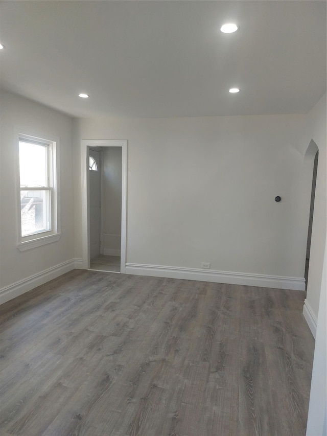11 John Ave, Hempstead, NY 11003 - unfurnished room with baseboards, wood finished floors, recessed lighting, and arched walkways