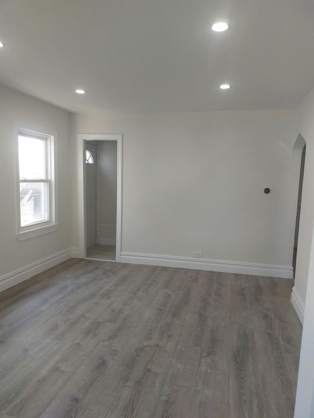 11 John Ave, Hempstead, NY 11003 - unfurnished room featuring baseboards, wood finished floors, recessed lighting, and arched walkways